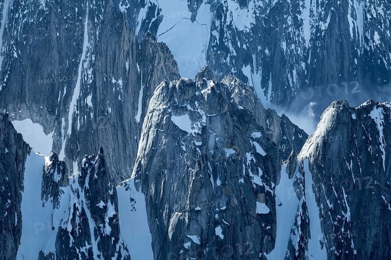 Snow and ice, epic mountains with steep cliffs, aerial view, Alaska Range, Denali National Park, Alaska, USA