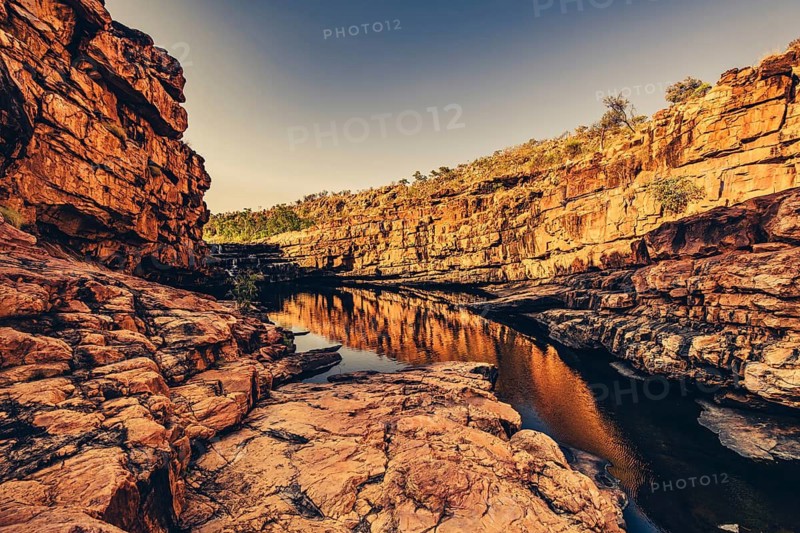 Bell Gorge waterfall, a body of water in north-west Australia in the Kimberley. Sunrise in the outback, Australia