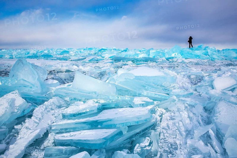 Lake Baikal is located in southern Siberia, Russia, near the city of Irkutsk. It is the deepest lake in the world, with a maximum depth of about 1, 642 meters (5, 387 feet), and the largest freshwater lake by volume, containing roughly 20% of the world's surface freshwater. Its surface area spans approximately 31, 500 km² (12, 200 sq mi). Baikal is a unique ecosystem, home to hundreds of endemic plant and animal species, including the famous Baikal seal, and plays a crucial role in the region's climate and biodiversity. Due to its outstanding natural significance, it was designated a UNESCO World Heritage Site in 1996