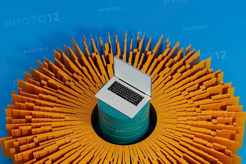 A laptop stands surrounded by vibrant data elements, symbolizing connection and network activity for artificial intelligence technology
