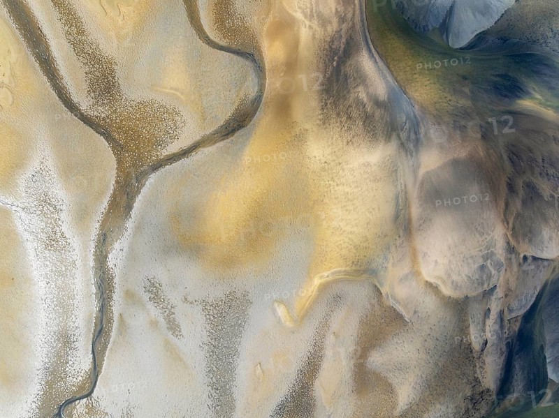 Streams and marshes at low tide in the wetlands of the Walvis Bay lagoon. Aerial view. Drone shot. Walvis Bay, Namibia