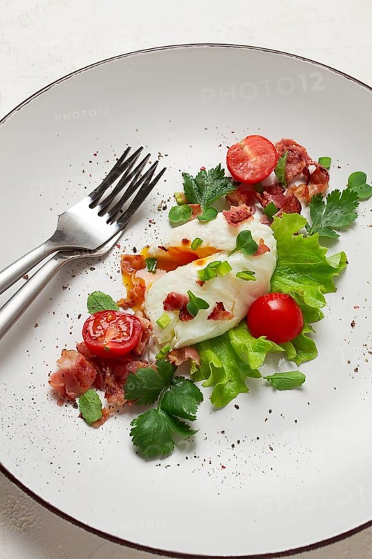 Poached egg, with bacon and vegetables, breakfast, homemade