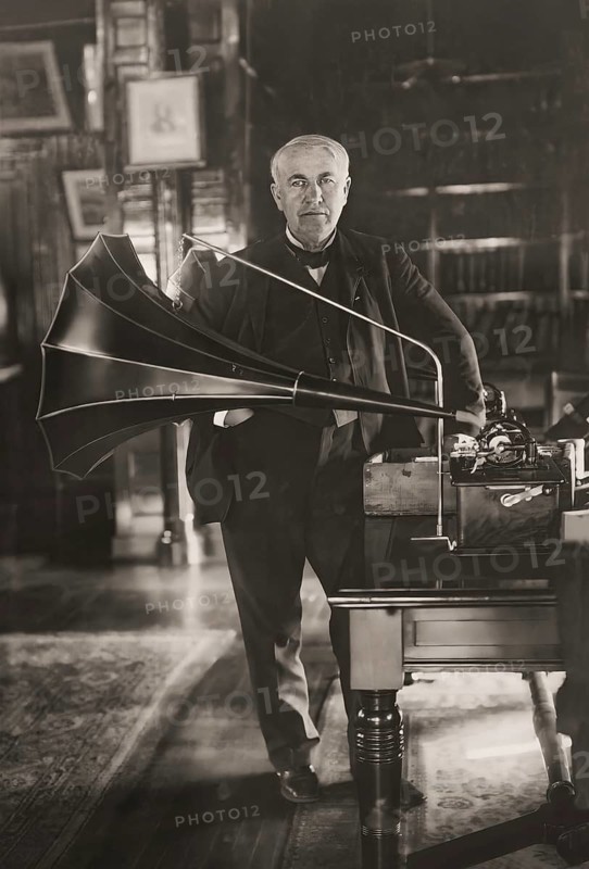 Thomas Alva Edison with his cylinder phonograph, digitally edited according to a photography by Geo. G. Bain, 1908