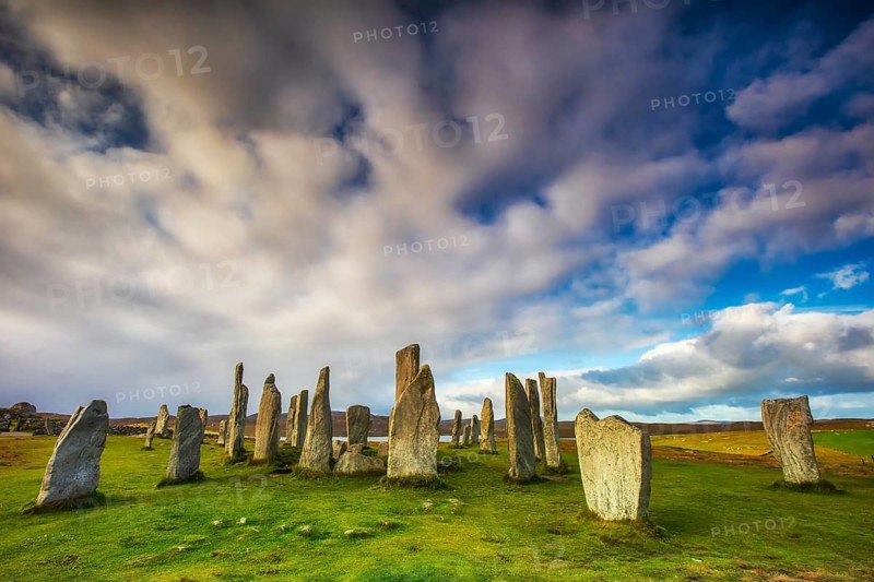 The Calanais Standing Stones are an extraordinary cross-shaped setting of stones, located on the Isle of Lewis in the Outer Hebrides, Scotland. They were erected 5, 000 years ago, predating England's famous Stonehenge, and served as an important site for ritual activity for at least 2, 000 years