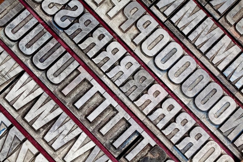 Hot metal printing setting, old letters made of lead for letterpress printing, Lettern aus dem Buchdruck, Bleisatz
