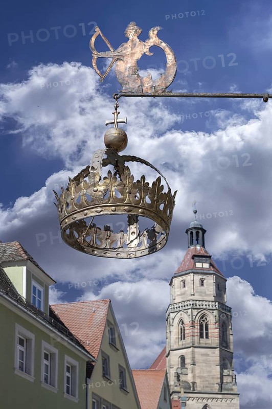 Nose sign of the Hotel Restaurant Krone, 15th century, Rosenstraße 10, behind the tower of the parish church of St Andrew, Weißenburg, Middle Franconia, Bavaria, Germany
