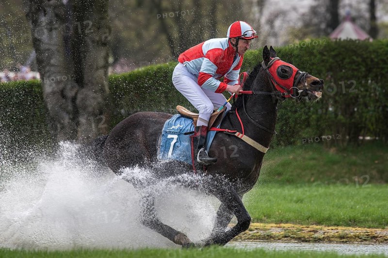 WROCLAW, POLAND - APRIL 15, 2018: International race with obstacles for five years and older horses at Racecourse WTWK Partynice. The opening day of the season. In action jockey Z. Lica on the horse Netto