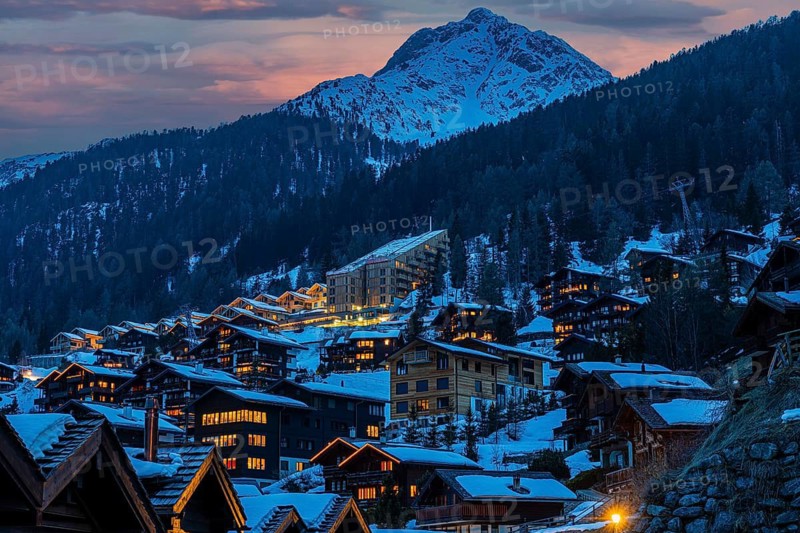 Snow-covered hotels and chalets built into the hillside, the snow-capped summit of Sex de Marinda at the back, sunset, Grimentz, Val d'Anniviers, Valais Alps, Canton of Valais, Switzerland