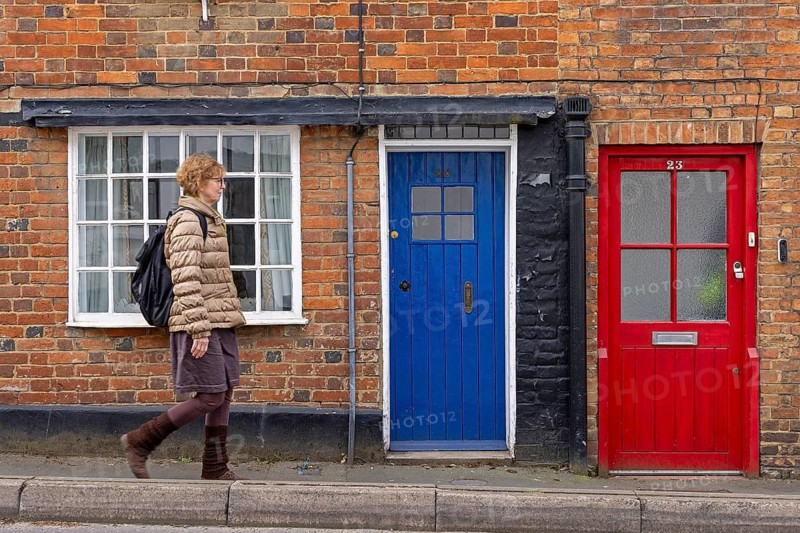 Coloured doors, woman, Buckingham, England, Great Britain