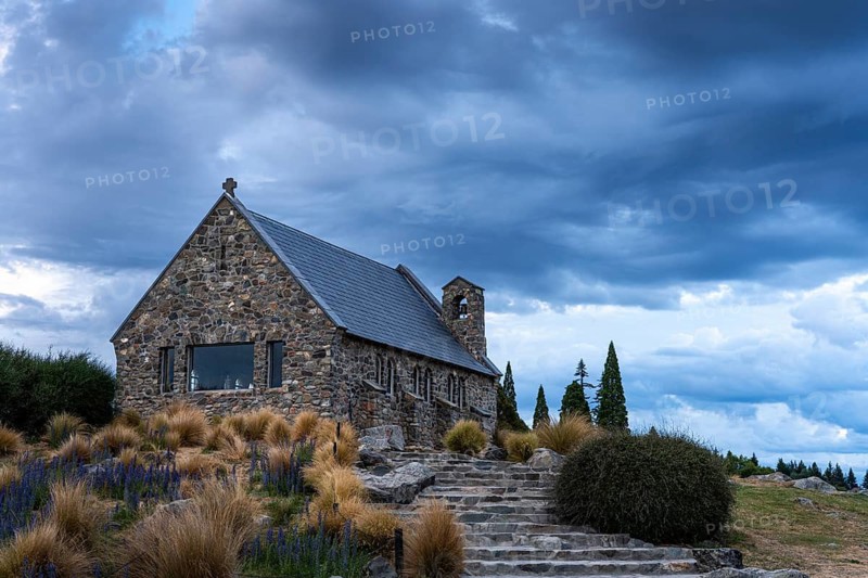 The small church The Church of the Good Shepherd on Lake Tekapo with a cloudy sky. Canterbury, South Island, New Zealand