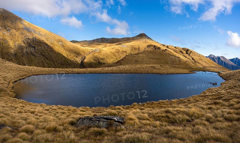 Mountain landscape with lake. Mount Burns, Borland Road Area, Fiordland National Park, Southland Region, South Island, New Zealand