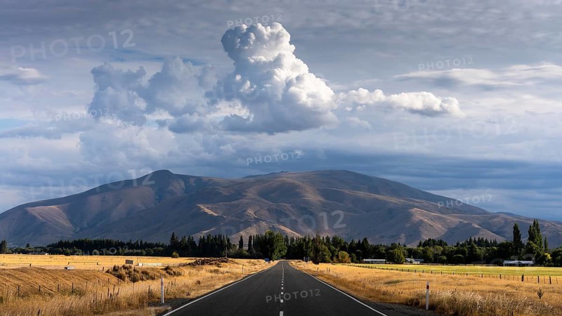 Landscape with road and mountains. View of Benmore Range. Twizel, Canterbury, South Island, New Zealand
