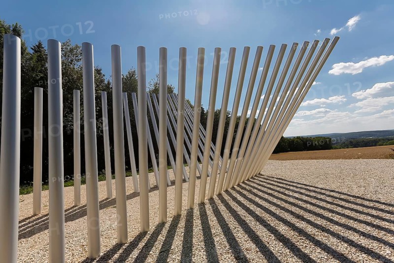 Art in public space, sculpture made of aluminum profile pipes by artist Martin Burchard, life's horizon path near Mundingen, light and shadow, gravel, clouds, blue sky, walk-in art, paths of reflection and refreshment on the Ehinger Alb, Baden-Württemberg, Germany