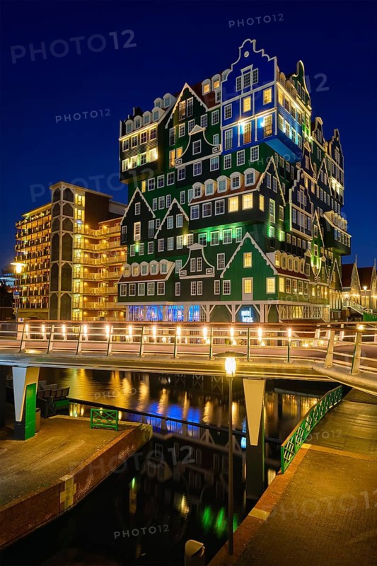 ZAANDAM, NETHERLANDS, MAY 8, 2017: Inntel Hotel in Zaandam illuminated at night. Design of 12-storey tall building opened in 2009 is the result of stacking a series of traditional Dutch houses
