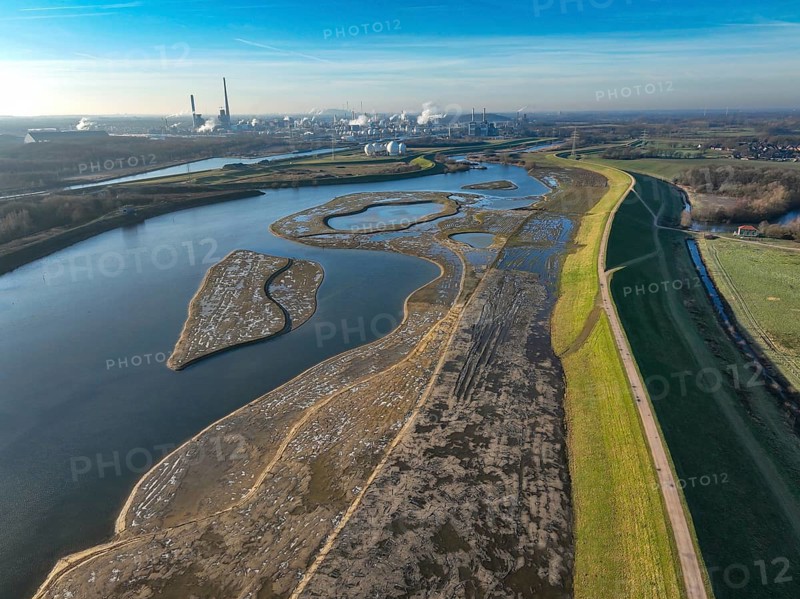 Haltern-Marl, North Rhine-Westphalia, Germany - Lippe, flood protection in the Haltern-Lippramsdorf-Marl area (HaLiMa) . Flood protection on the River Lippe by relocating the dyke and thus extending the floodplain. On the right, the completed floodplain north, the north dyke. Work is still underway on the south dyke. Marl Chemical Park in the back