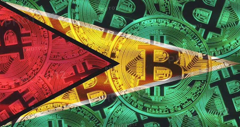 Bitcoin coins on Guyana flag background. Golden bitcoin coins on Guyana flag background