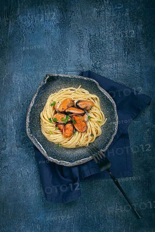 Spaghetti with mussels, without shell, pasta with peeled mussels, in carbonara sauce, micro-greens, homemade, no people