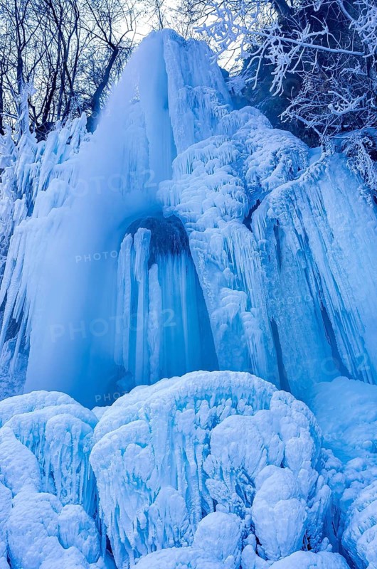 Urach waterfall full of bizarre ice formations frozen at winter temperatures, Bad Urach, Swabian Jura, Baden-Württemberg, Germany