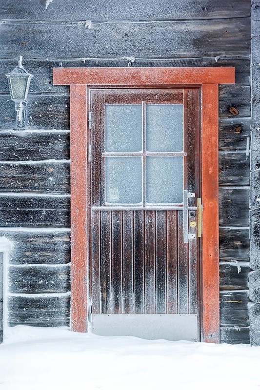 Europe, Finland, Lapland, frozen wooden house, ice window