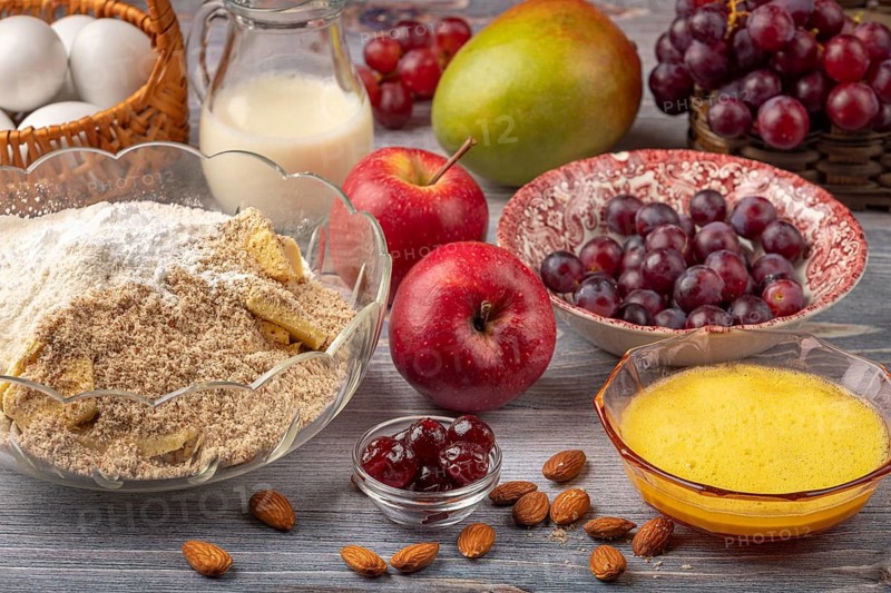 Bowl with baking ingredients in addition to eggs, milk and fruit