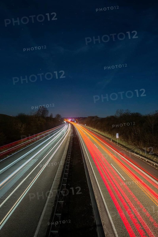 A7 Motorway, Autobahn, beside Kassel at night with light trails from the traffic headlights and taillights, Hesse, Germany