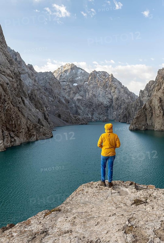 Hiker in front of Kol Suu Mountain Lake, Kol Suu Lake, Sary Beles Mountains, Naryn Province, Kyrgyzstan
