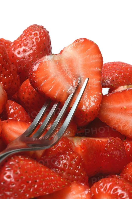 Halved strawberries in a bowl, Fragaria