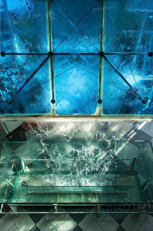 Water flows over glass surface