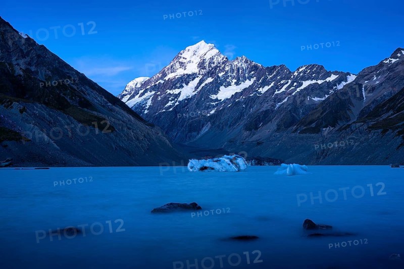 Mountainous landscape. Hooker Lake and Aoraki Mount Cook. Evening mood, blue hour. Aoraki Mount Cook National Park, Canterbury, South Island, New Zealand
