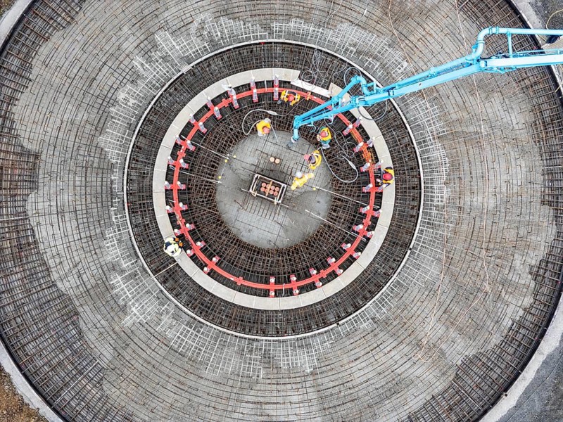 Concreting, concreting the foundation of a wind turbine, more than 600 cubic meters of concrete will be pumped into the foundation for over 7 hours, over 100 tons of reinforcing steel have been used, the wind turbine will have a hub height of 160 meters, part of a new wind farm in Sauerland, near Balve, North Rhine-Westphalia, Germany
