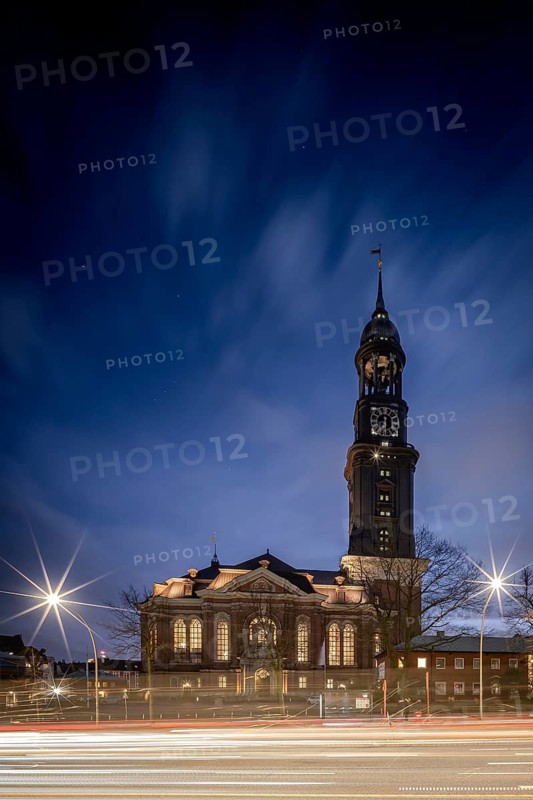 St Michael's Church (Michel) at blue hour with traces of light from vehicles in the foreground, Hamburg, Germany