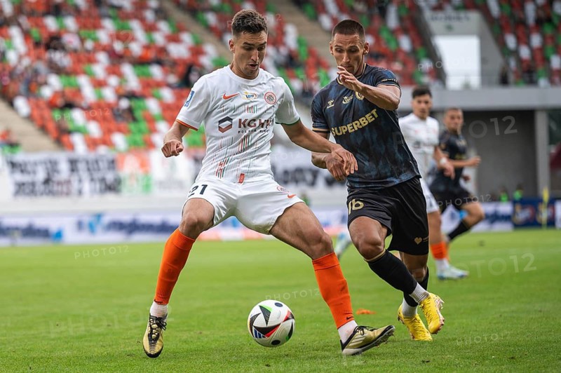 LUBIN, POLAND - AUGUST 31, 2024: Football match Polish PKO Ekstraklasa between KGHM Zaglebie Lubin vs Lech Poznan. Tomasz Pienko (L) Grzegorz Rogala (R).