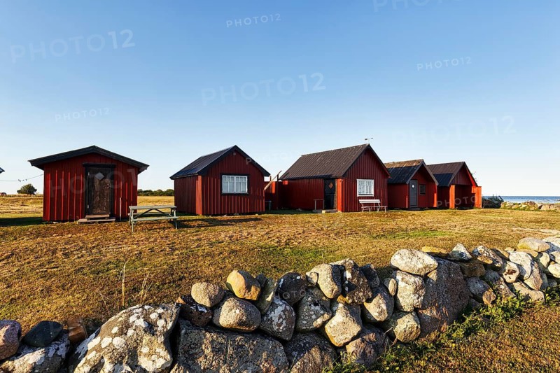 Traditional red fishing huts, Sjöbodar, holiday homes on the Baltic Sea coast, coastal landscape, Bodudden, Löt, Öland island, Kalmar län, Sweden