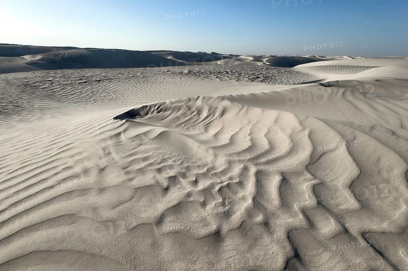 White sand dunes in the Khaluf Desert, Oman
