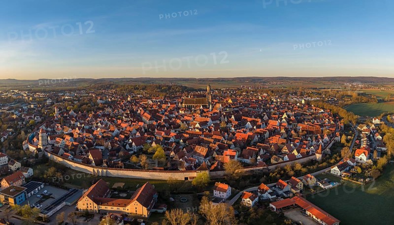 Aerial view, panorama of the historic old town of Nördlingen with the completely comprehensive and accessible city wall, in the town center the church of St. Georg with the 90-meter high church tower, called Daniel, Donau-Ries district, Nördlinger Ries, Bavaria, Germany