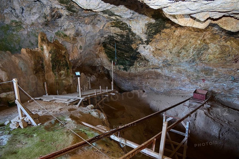 View of a barren cave environment with wooden walkways and natural rock structures, museum, Charkadio Cave, Dwarf Elephant (Palaeolodoxon tiliensis), Elephas Tiliensis, Megalo Chorio, Zero Waste Island, Tilos, Dodecanese, Greek Islands, Greece