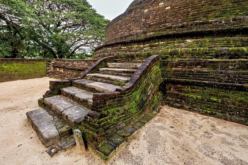 Treaded ancient brick steps, partly covered with moss, temple ruins near Sigiriya in Sri Lanka