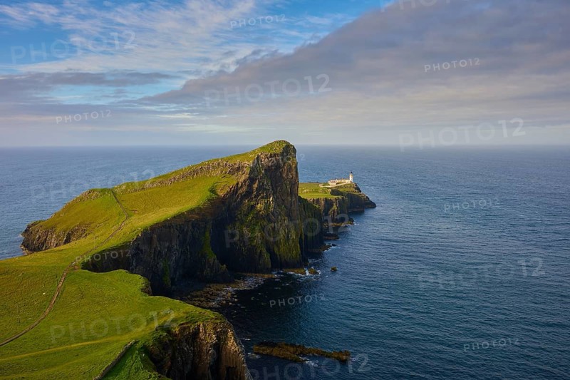 Wide landscape with a lighthouse on a green cliff by the sea, Neist Point Lighthouse, Waterstein, Isle of Skye, Scotland, United Kingdom, Great Britain