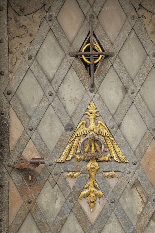 Front door with metal fittings and golden eagle figure relief, door knock ring, door knocker, hatch, pattern, detail, Kronberg, Taunus, Hesse, Germany