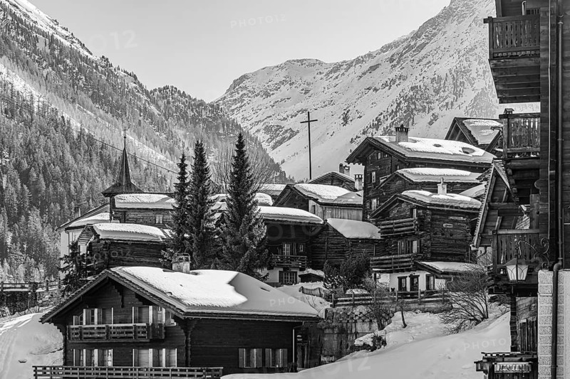 Snow-covered old farmhouses, large wooden cross, black and white photo, historic town center, Grimentz, Val d'Anniviers, Valais Alps, Canton of Valais, Switzerland