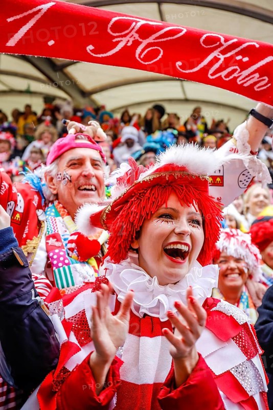 Colourfully costumed carnivalists celebrate carnival in Cologne, on Weiberfastnacht the street carnival is traditionally opened on the Alter Markt, which then reaches its climax on Rosenmontag, Cologne, Rhineland, North Rhine-Westphalia, Germany