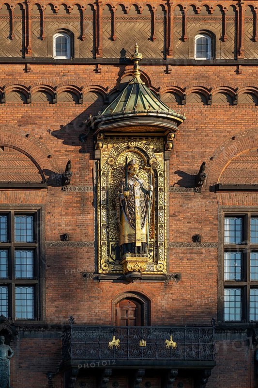 Brick façade with gilded sculpture of Bishop Absalon, Town Hall in the National Romantic style by Martin Nyrop, Town Hall Square, Rathausplatz or Rådhuspladsen, Copenhagen, Denmark
