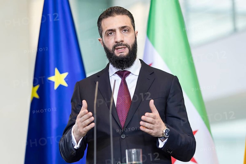 Ahmed al-Sharaa (President of the Syrian Arab Republic) at a joint press conference with Friedrich Merz (Chancellor of the Federal Republic of Germany, CDU) after a one-on-one meeting at the Federal Chancellery, Berlin, 30 March 2026