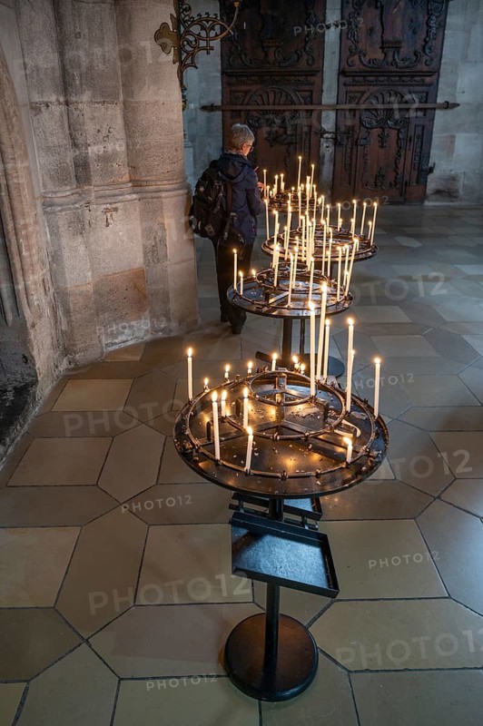 Sacrificial candles in the late Gothic hall church of St George, Dinkelsbühl, Bavaria, Germany