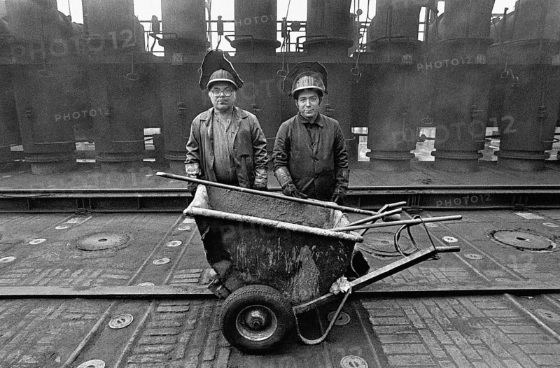 Workers at the Zollverein coking plant. The coking plant was discontinued in 1993. Together with Zollverein Colliery, the former coking plant was declared a World Heritage Site by UNESCO in 2001, Essen, Germany