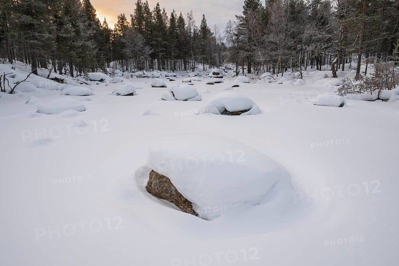 Frozen and snowy stream, Lapland, Finland, January 2025
