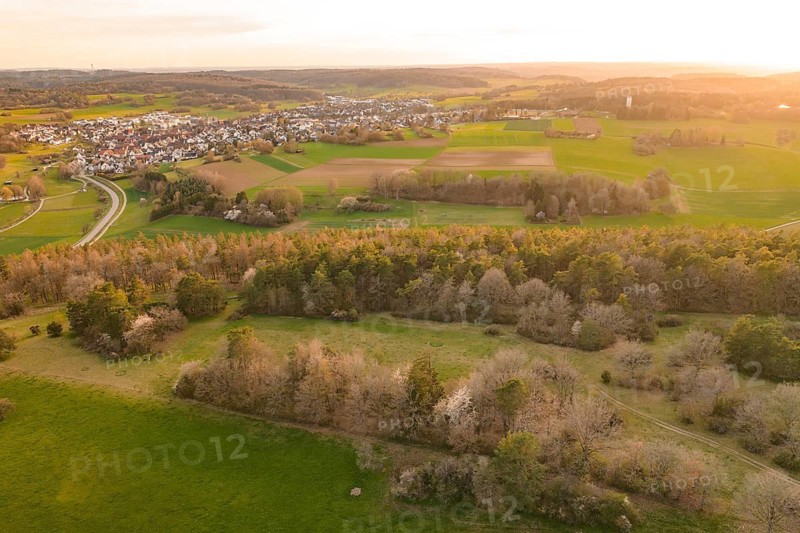 Panorama of fields, forests and a village in warm evening light, e-bike tour, old sports ground in Gechingen, Hecken and Gäu region, Calw district, Germany