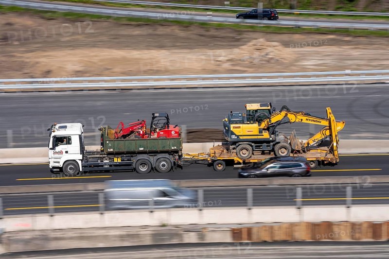 Car transporters, vehicles are being transported, A3 motorway, construction machinery, excavators