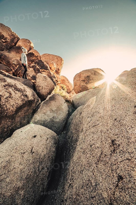 Woman hiking at sunrise in Joshua Tree National Park