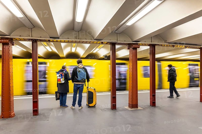 Alexanderplatz underground station with subway. People on the platform. Berlin, Germany
